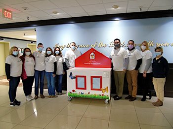 Pictured, from left: Christy Littrell, VP of Nursing; Katye Dame, Philanthropy Coordinator; Austin Elliott, Director of Philanthropy; Ursula Dugger, Executive Assistant; Lorie Oglesby, VP of HR and Education; Robert Ramey, President BHDM; Chris McEnaney, owner of local MCDonald's; Wade Williams, Executive Director; Theresa Floyd-Maas, Executive Director of RMH Charities of the Ohio Valley; Barb Abell- Development Manager with RMH Charities of the Ohio Valley